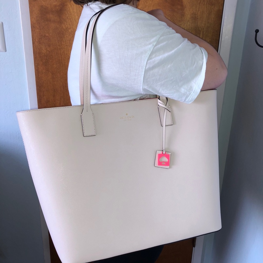 Cream and bright pink Kate Spade tote